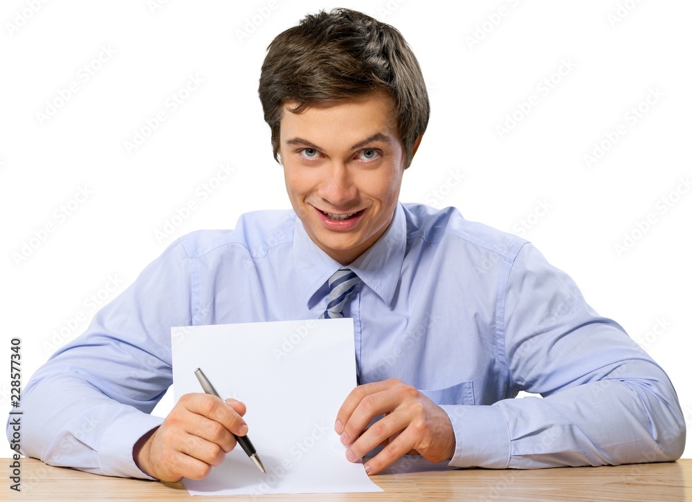Friendly Businessman Sitting at the Desk - Isolated Friendly Businessman Sitting at the Desk - Isolated