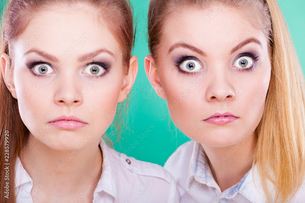 Two young women looking shocked Two young women looking shocked