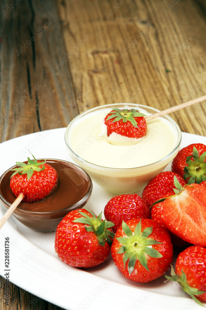 Fondue with Melting chocolate or melted chocolate and strawberry. Fondue with Melting chocolate or melted chocolate and strawberry.