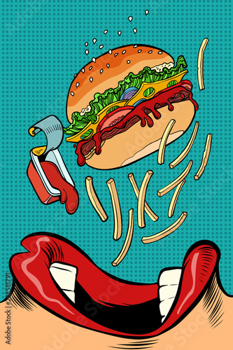 woman mouth eating a burger