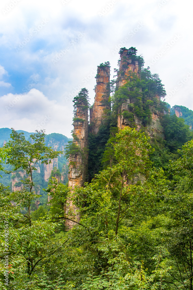 Fototapeta premium Sandstone mountains viewed from the trail from the 10 Mile Natural Gallery to Tianzi Mountain. Wulingyuan Scenic Area, Zhangjiajie, Hunan, China.