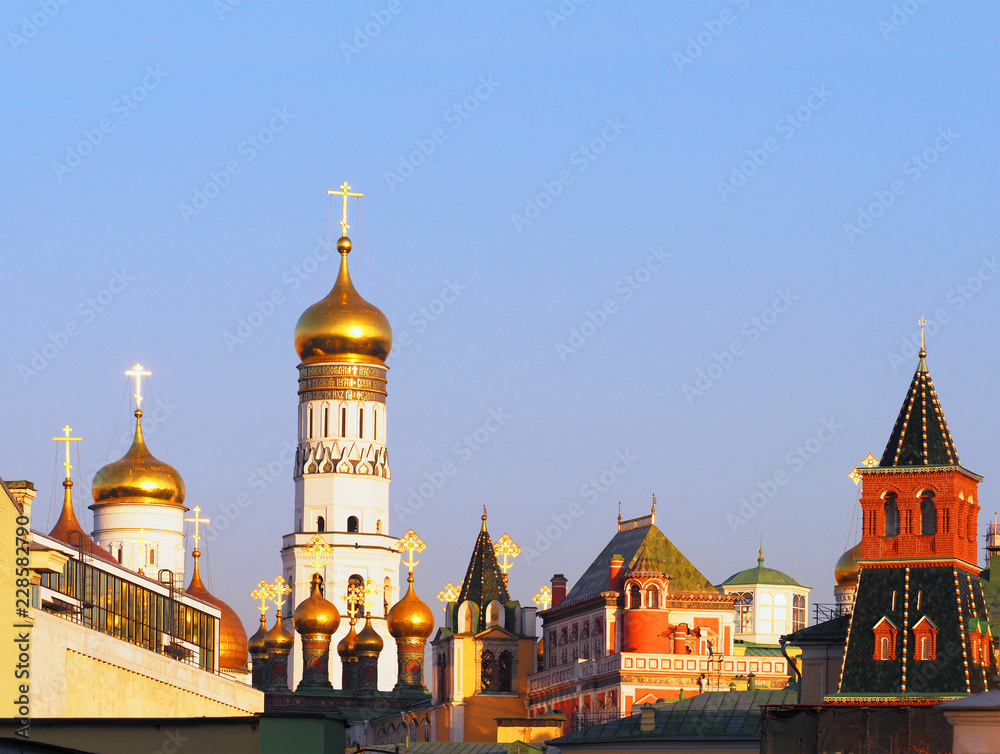 Roofs of the Moscow Kremlin, autumn sunset. Uspensky Cathedral, the Grand Kremlin Palace, Patriarch's Palace, Church of the Twelve Apostles