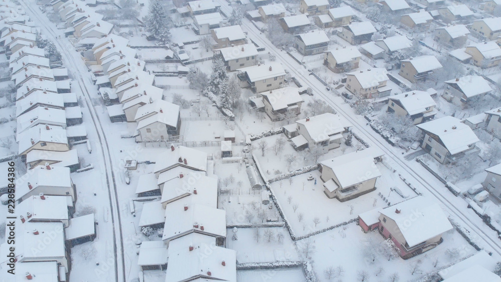AERIAL: Flying over the empty private properties on a idyllic snowy winter day. AERIAL: Flying over the empty private properties on a idyllic snowy winter day.