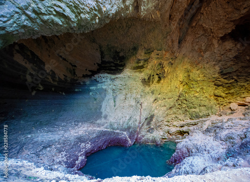 Mystic deep water hole in rocks in Fontaine-de-vaucluse, source of river Sourge in low stand during summer months.