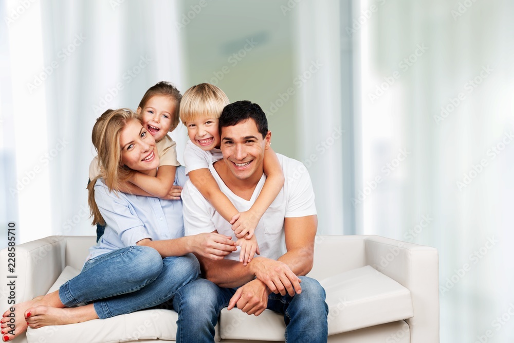 Young family at home smiling at camera Young family at home smiling at camera