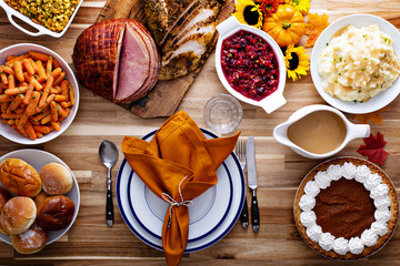 Thanksgiving table with turkey and sides
