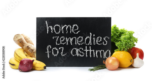 Natural products and slate board with text HOME REMEDIES FOR ASTHMA on white background