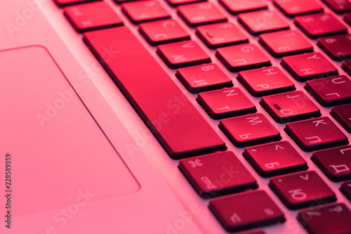 keyboard in the dark glowing in red photo