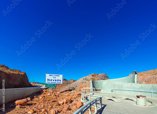 View of the mountain landscape and the sign "Welcome to Nevada", Boulder, USA. Copy space for text.