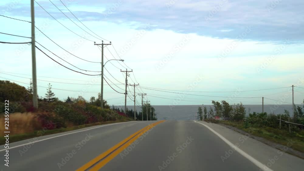 QUEBEC, CANADA - OCTOBER 2018: Cinematic & smooth views driving on coastal roads along La Gaspésie QUEBEC, CANADA - OCTOBER 2018: Cinematic & smooth views driving on coastal roads along La Gaspésie