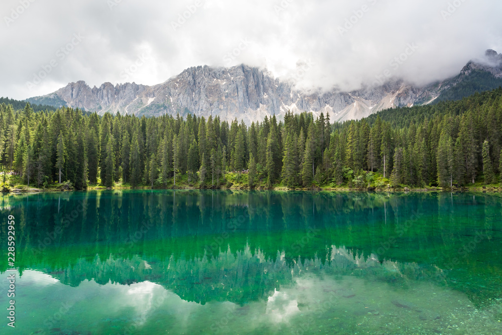 Lake Carezza during summer season, Dolomites mountains, Italy