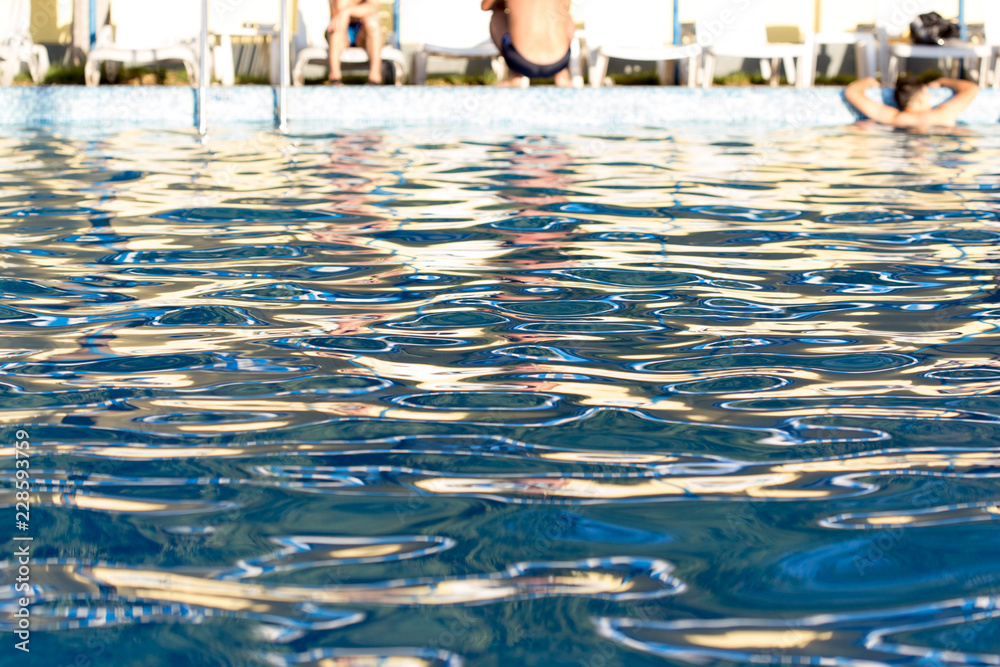 young man bathes in pool