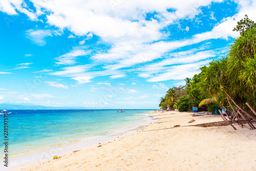 Fototapeta Naklejka Na Ścianę i Meble -  View of the sandy beach in Moalboal, Cebu, Philippines. Copy space for text.