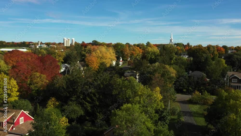 Aerial view of small agricultural town by the river during autumn in Canada Aerial view of small agricultural town by the river during autumn in Canada