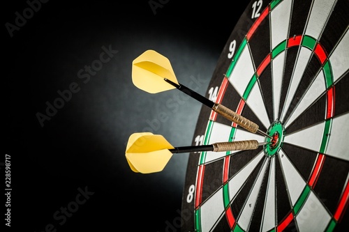 Fotografie Closeup of Darts in Bullseye