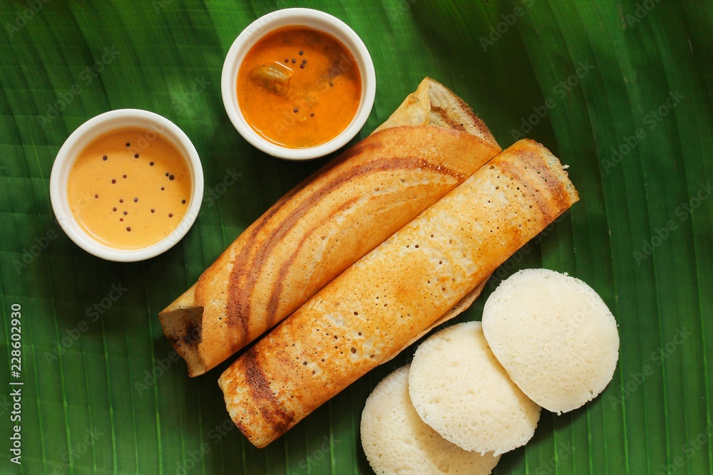 South Indian Vegetarian meal paper Masala Dosa chutney and sambar on