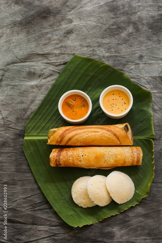 South Indian Vegetarian meal paper Masala Dosa chutney and sambar on