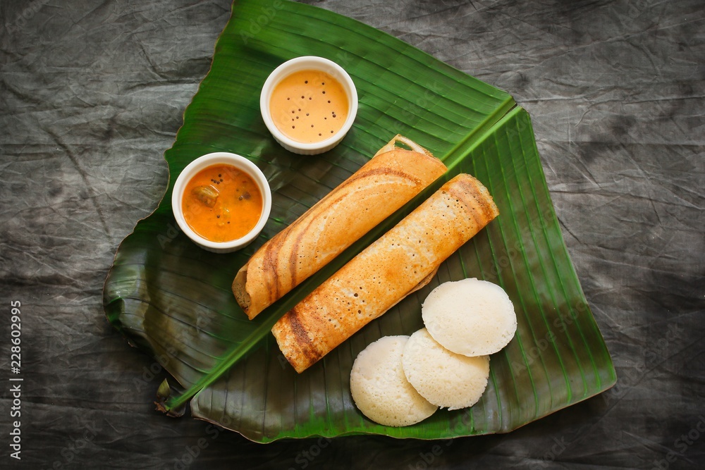South Indian Vegetarian meal paper Masala Dosa chutney and sambar on
