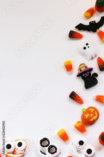 Assorted Halloween candy decorations isolated on white