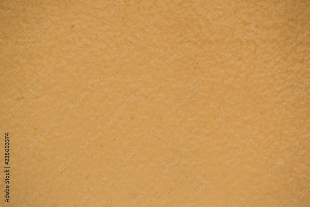 creamy, dark yellow wall texture background