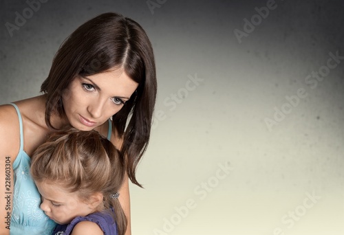 Portrait of sad Mother with daughter