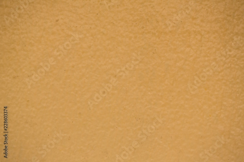 creamy, dark yellow wall texture background