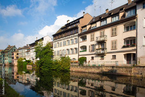 View of beautiful half-timbered houses along the canal seen from Strasbourg France © littleny