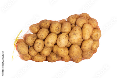 Raw potatoes in a sack isolated on white background