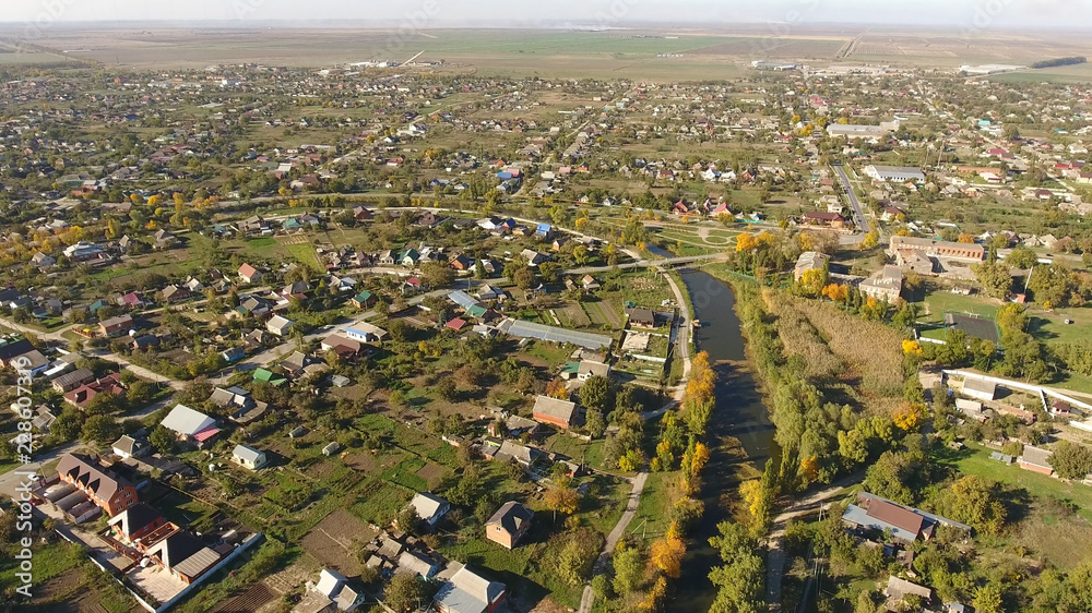 Obraz premium Top view of the village. The village of Poltavskaya. Top view of the village. One can see the roofs of the houses and gardens. Village bird eye view.