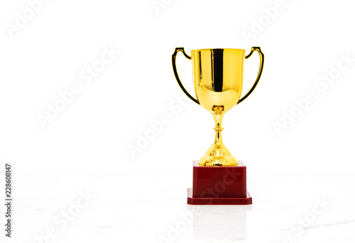 Golden trophy cup isolated on white background.