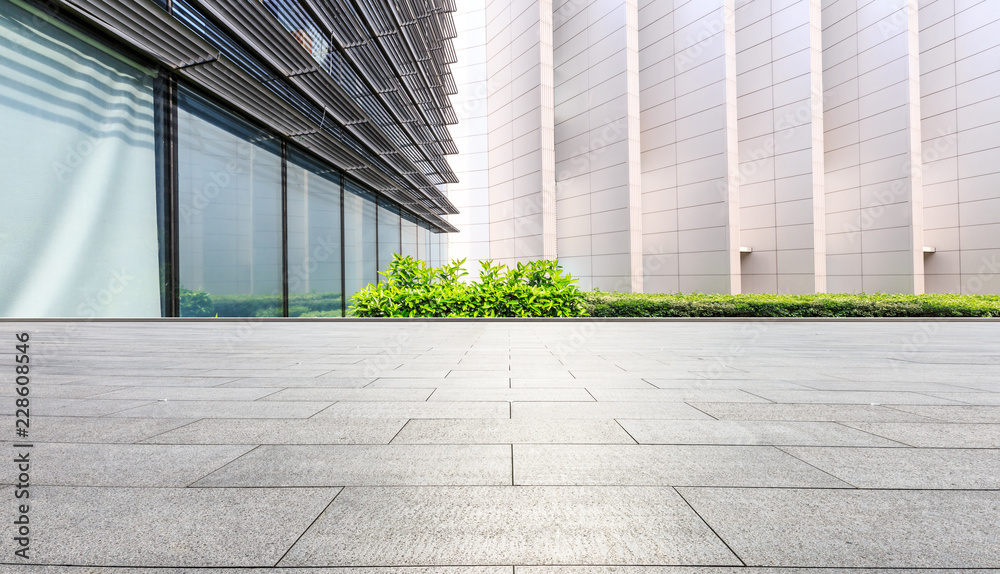 Empty square floor and modern city commercial building scenery