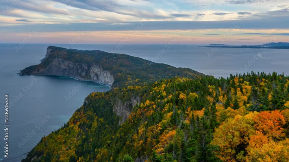 Evening time-lapse overlooking the peak of Forillon National Park during autumn with colorful trees Evening time-lapse overlooking the peak of Forillon National Park during autumn with colorful trees