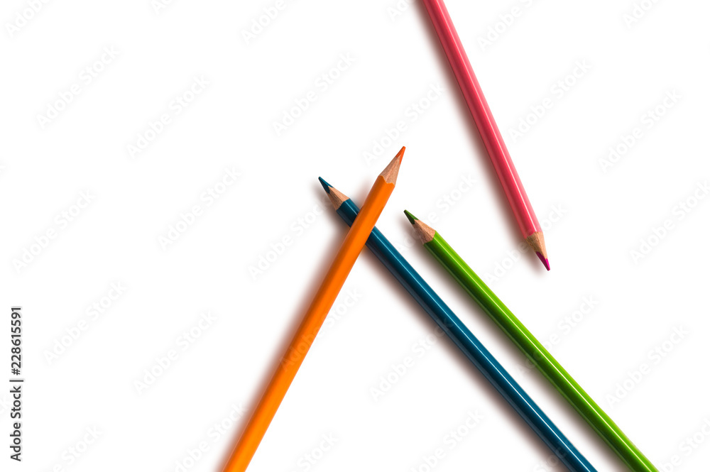 pencils orange, green, blue and pink, on white background pencils orange, green, blue and pink, on white background