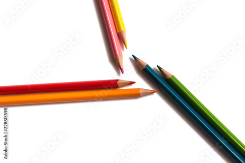 pencils orange, red, green, blue, pink and yellow on a white background