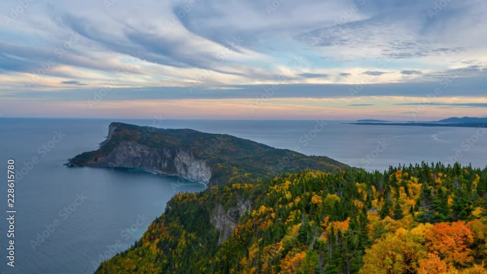 Evening time-lapse overlooking the peak of Forillon National Park during autumn with colorful trees Evening time-lapse overlooking the peak of Forillon National Park during autumn with colorful trees