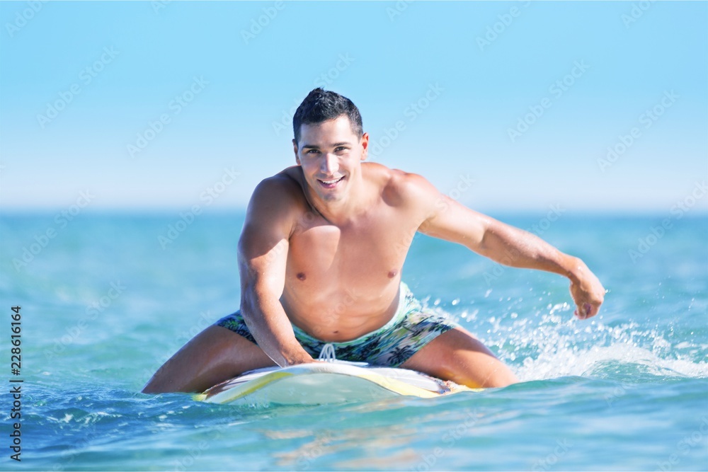 Surfer beach lifestyle people - man surfing