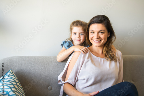 mother and daughter Having great time on the sofa