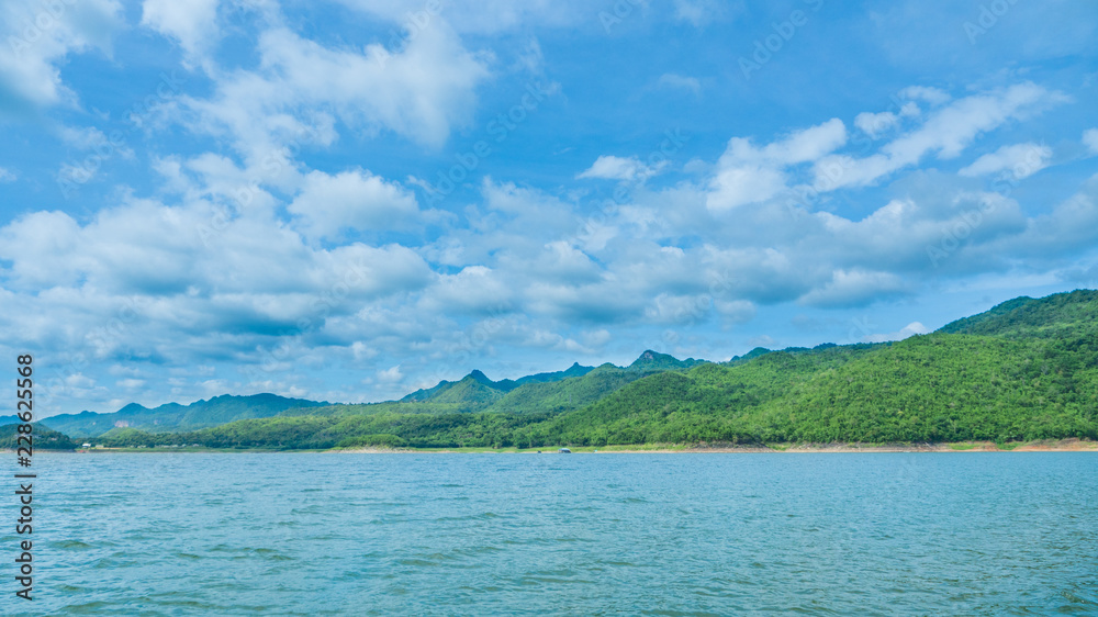 This serene lake on a summer season with cloudy weather in dam Srinagarindra of Khuean Srinagarindra National Park at beautiful kanchanaburi province of thailand.