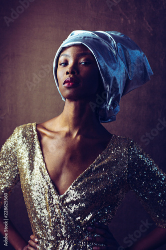 Woman wearing turban and sequin dress