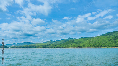 This serene lake on a summer season with cloudy weather in dam Srinagarindra of Khuean Srinagarindra National Park at beautiful kanchanaburi province of thailand. © I Am G.Guide