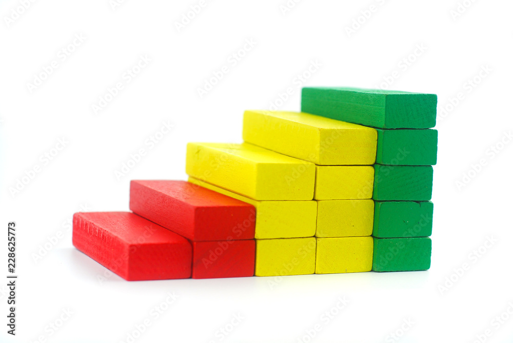 Fototapeta premium Stack of wooden block in graph shape. Business concept