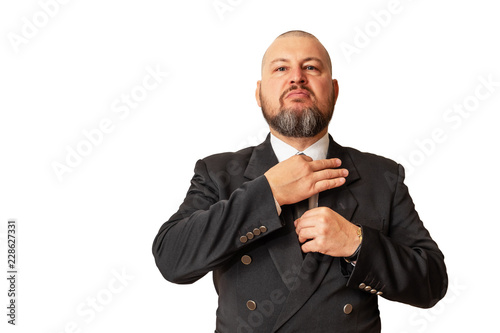 Respectable man demonstrates its superiority by adjusting the necktie.
