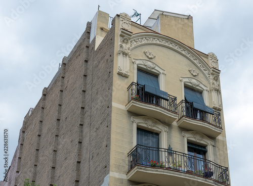 Upper part of building on Travessera de Gracia Street, Barcelona. photo