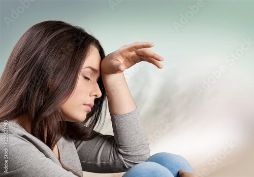 Fotografi Woman having headache on abstract background