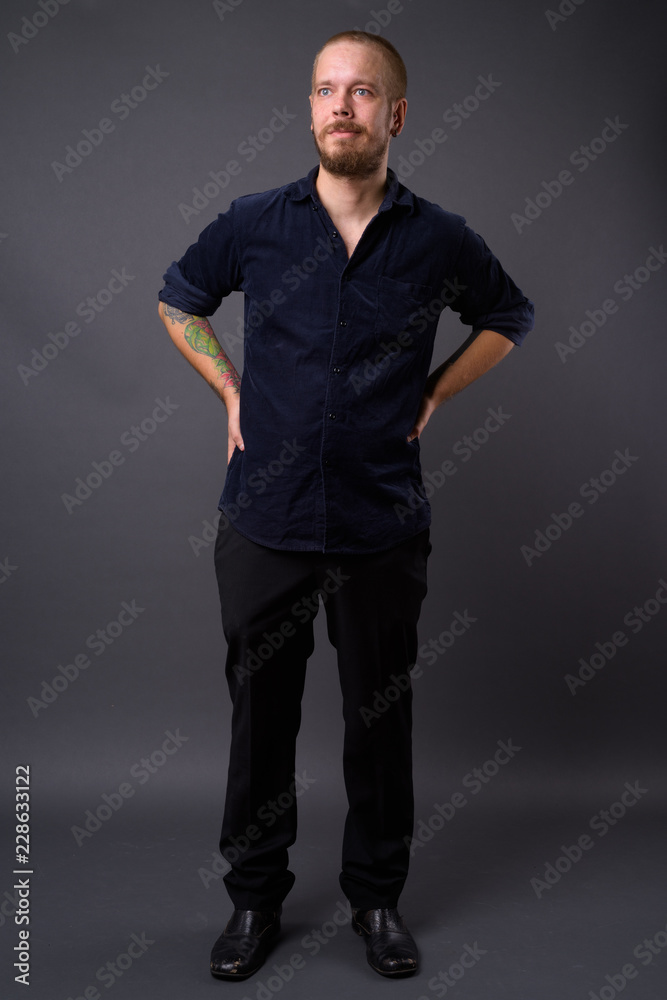 Portrait of man against gray studio background Portrait of man against gray studio background