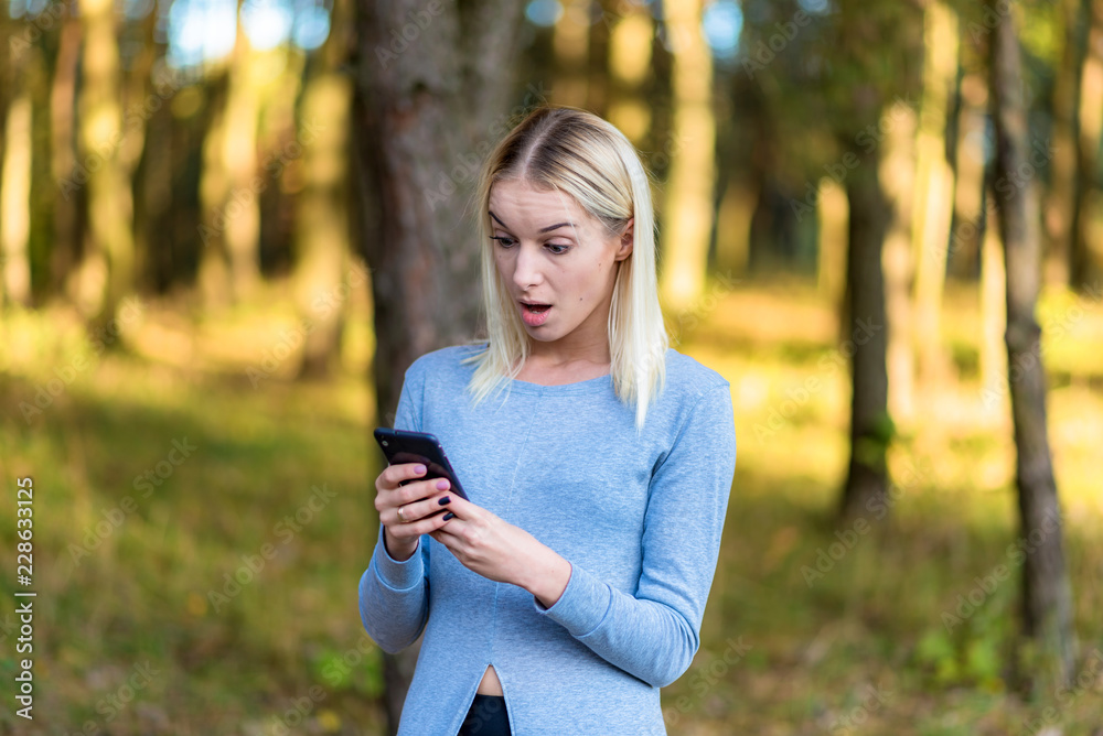 Photo portrait of a beautiful blonde girl in the park on the street in the sunset sun evening. Photo portrait of a beautiful blonde girl in the park on the street in the sunset sun evening.