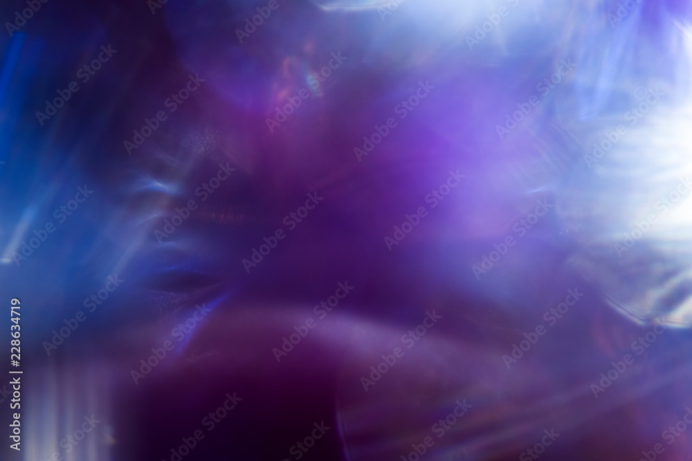 Blue spots of light on black background