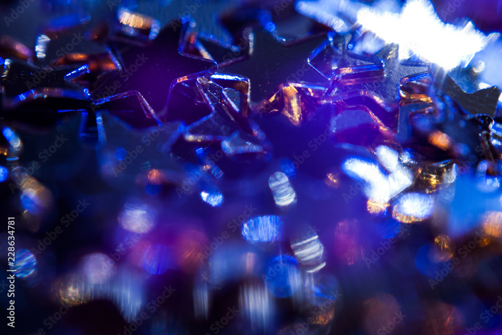 Blue spots of light on stars background
