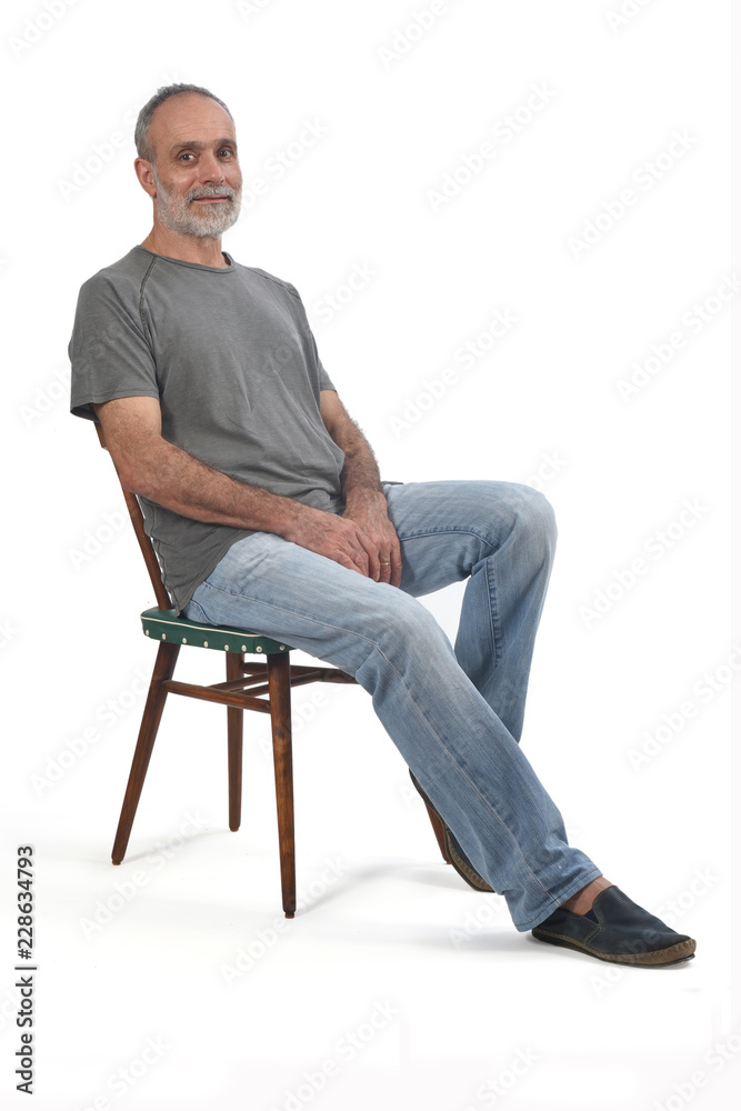 portrait of middle aged man sitting on white portrait of middle aged man sitting on white