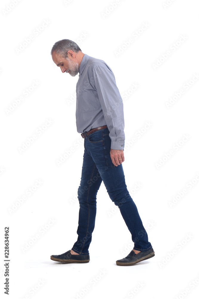 Naklejka premium middle-aged man with blue jeans and shirt on white background